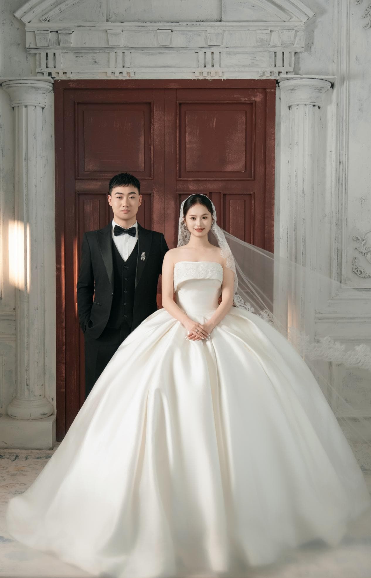 Romantic wedding couple embracing at sunset